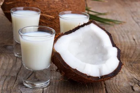 Coconut milk and shells Stock Photos