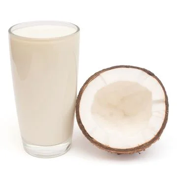 Coconut milk with fresh half nut isolated on a white background. Creative c.. Stock Photos
