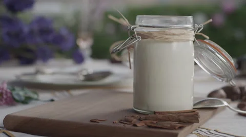 Coconut milk in jar on table Stock Footage 67021808