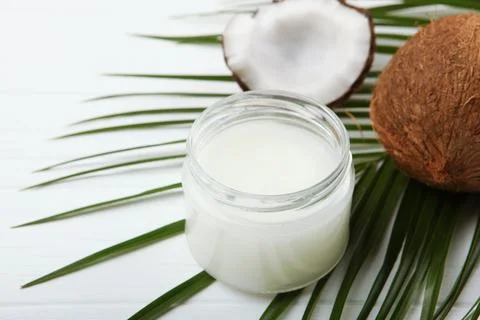 Coconut oil and coconuts on the table Stock-Fotos