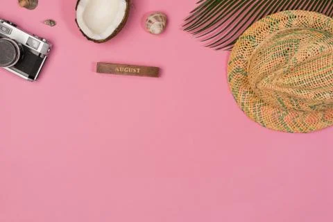 Coconut, palm leaf, hat,  on a pink background, top view Stock Photos