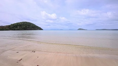 Coconut palm trees along tropical beach with white sand and turquoise sea Stock Footage 332486202