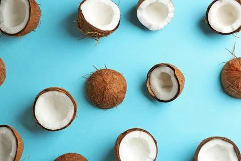 Coconut pattern on color background, flat lay Stock Photos
