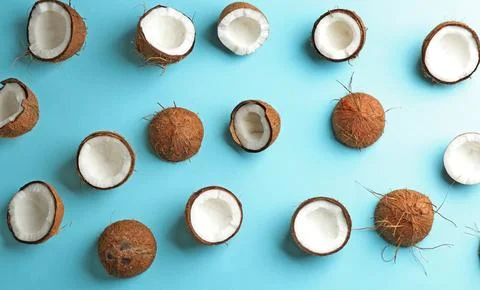 Coconut pattern on color background, flat lay Stockfoto's