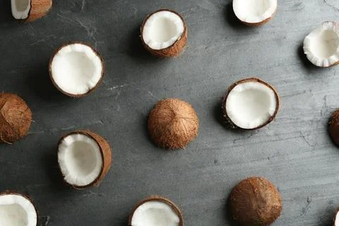 Coconut pattern on grey table, flat lay Stock Photos