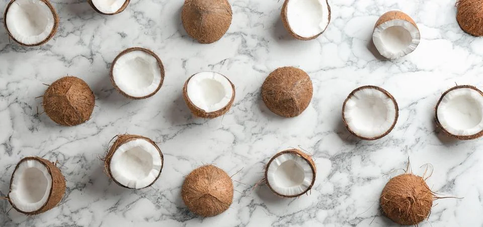 Coconut pattern on marble table, flat lay Stock Photos