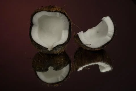 Coconut on a red background. Dark background Foto stock