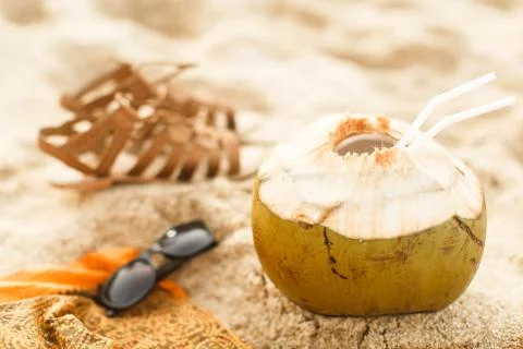 Coconut on sand at beach Stock Photos