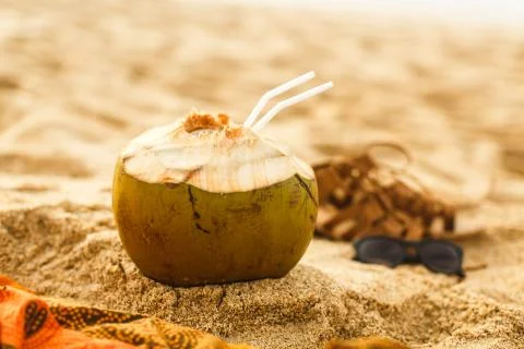 Coconut on sand at beach Stock Photos