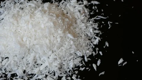 Coconut shaving. Ground coconut. Small slices of coconut. Stock Footage 90778760