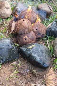 Coconut Shells Burning with Fire and Smoke 스톡 사진