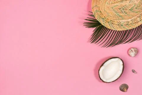 Coconut, shells, hat,  on a pink background top view Stock Photos