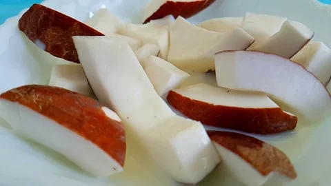 Coconut slices falling slow-motion shot with milk Video stock 89713397