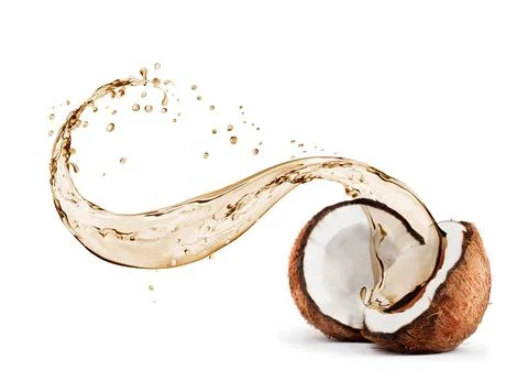 Coconut with splashes of juice close-up, isolated on white background Stock Photos