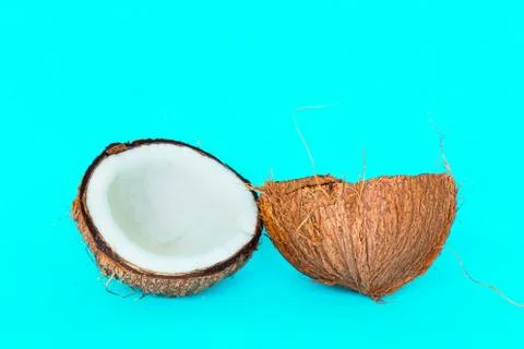 Coconut is split into two parts. Stock Photos