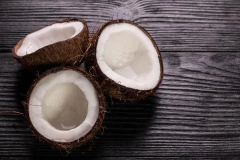 Coconut on wooden table. Stock Photos