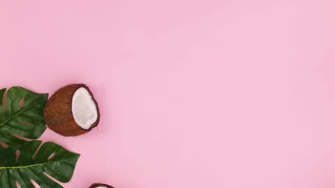 Coconuts and coco powder appear on left side of pink theme. Stop motion Stock-Footage 147104200