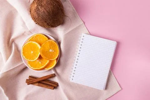 Coconuts and sliced oranges Stock Photos