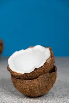 Coconuts on blue background, space for text Stock Photos