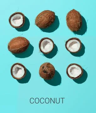Coconuts on blue background, top view Stock Photos