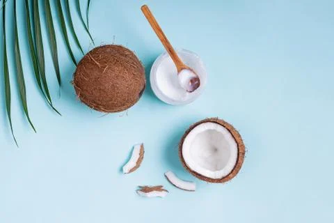 Coconuts on blue background, top view. Stock Photos