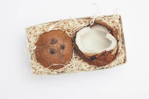 Coconuts in a box on a white background isolate, copy space, flatley Stock Photos