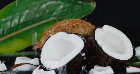 To coconuts falling water drops. Video stock 127443044