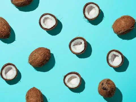 Coconuts half on blue background Stock Photos