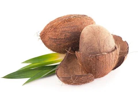 Coconuts with leaves on a white background Stock Photos