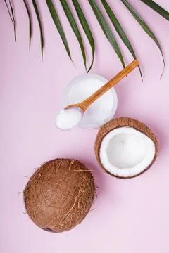 Coconuts on pink background, top view. Stock Photos