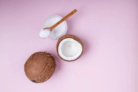 Coconuts on pink background, top view. Stock Photos