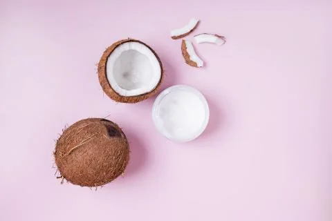 Coconuts on pink background, top view. Stock Photos