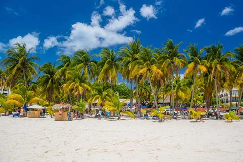 Cocos beach bar on a beach with white sand and palms on a sunny day, Isla Muj Stock Photos