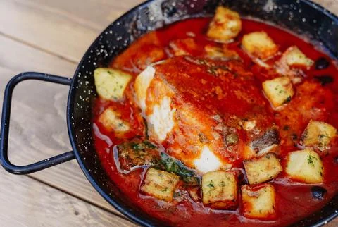 Cod and potato casserole in sauce Stock Photos