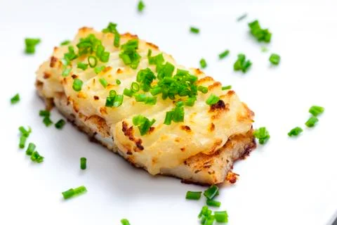 Cod baked with mashed potatoes Stock Photos