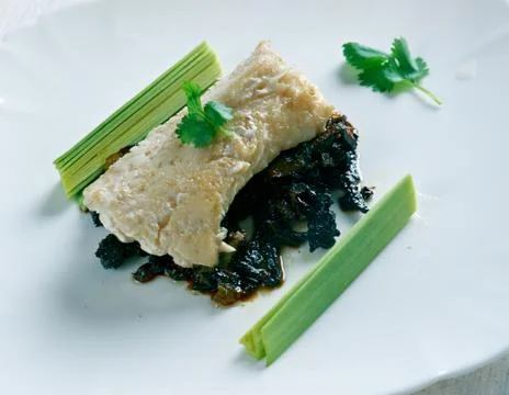 Cod with caramelized onions Stock Photos