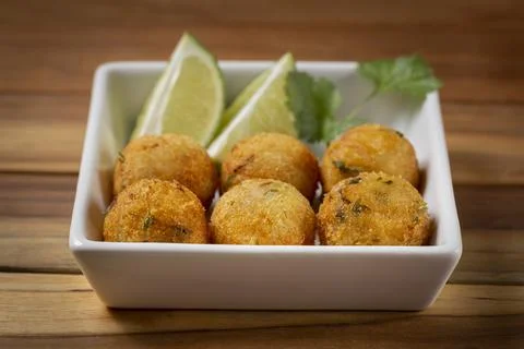 Cod dumpling. Traditional brasilian snack. Bunuelos de bacalo. Stock Photos
