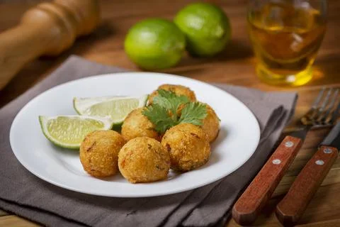 Cod dumpling. Traditional brasilian snack. Bunuelos de bacalo. Stock Photos