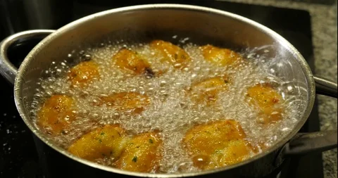 Cod dumplings - bolinhos de bacalhau - Fried ball of cod -Portuguese Food Stock Footage 127637856