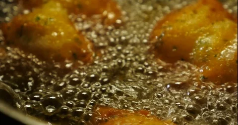 Cod dumplings - bolinhos de bacalhau - Fried ball of cod -Portuguese Food Stock Footage 127637919