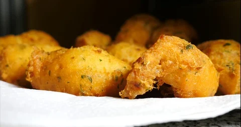 Cod dumplings - bolinhos de bacalhau - Fried ball of cod -Portuguese Food Stock Footage 127637959