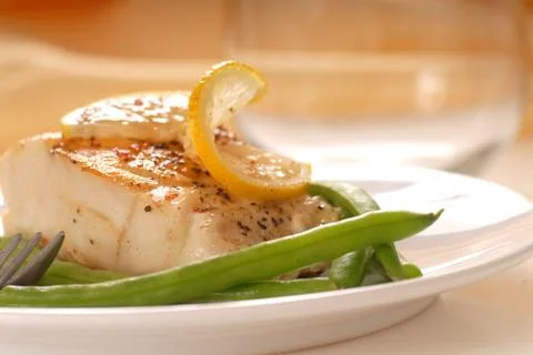Cod fillet with green beans Stock Photos