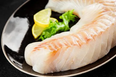 Cod fillet, raw fish seafood tasty snack fresh pescetarian diet gourmet foo.. Stock Photos