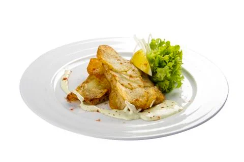 Cod fillets with lemon and salad Stock Photos