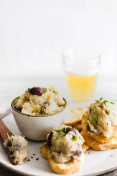 Cod fish brandade on a white ceramic and rustic napkin Stock Photos