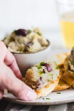 Cod fish brandade on a white ceramic and rustic napkin Stock Photos