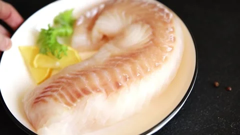 Cod fish fillet, raw fish seafood tasty snack fresh pescetarian diet 스톡 동영상 331299558