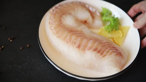 Cod fish fillet, raw fish seafood tasty snack fresh pescetarian diet 스톡 동영상 331299562