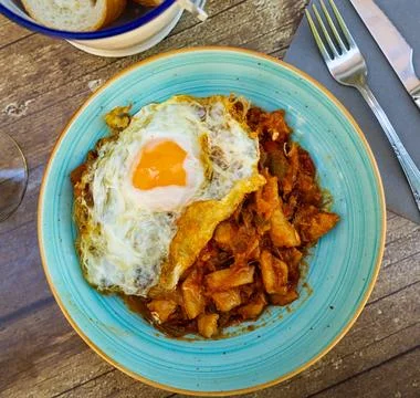 Cod fish served with eggs and garlic Stock Photos