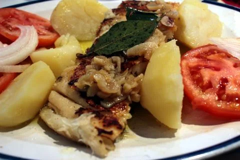 Cod with garlic Stock Photos